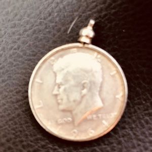 1964. Half dollar can be used with chain